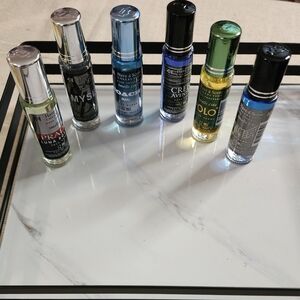 Men body sented oils..polo,creed,coach prada,myself, invictus